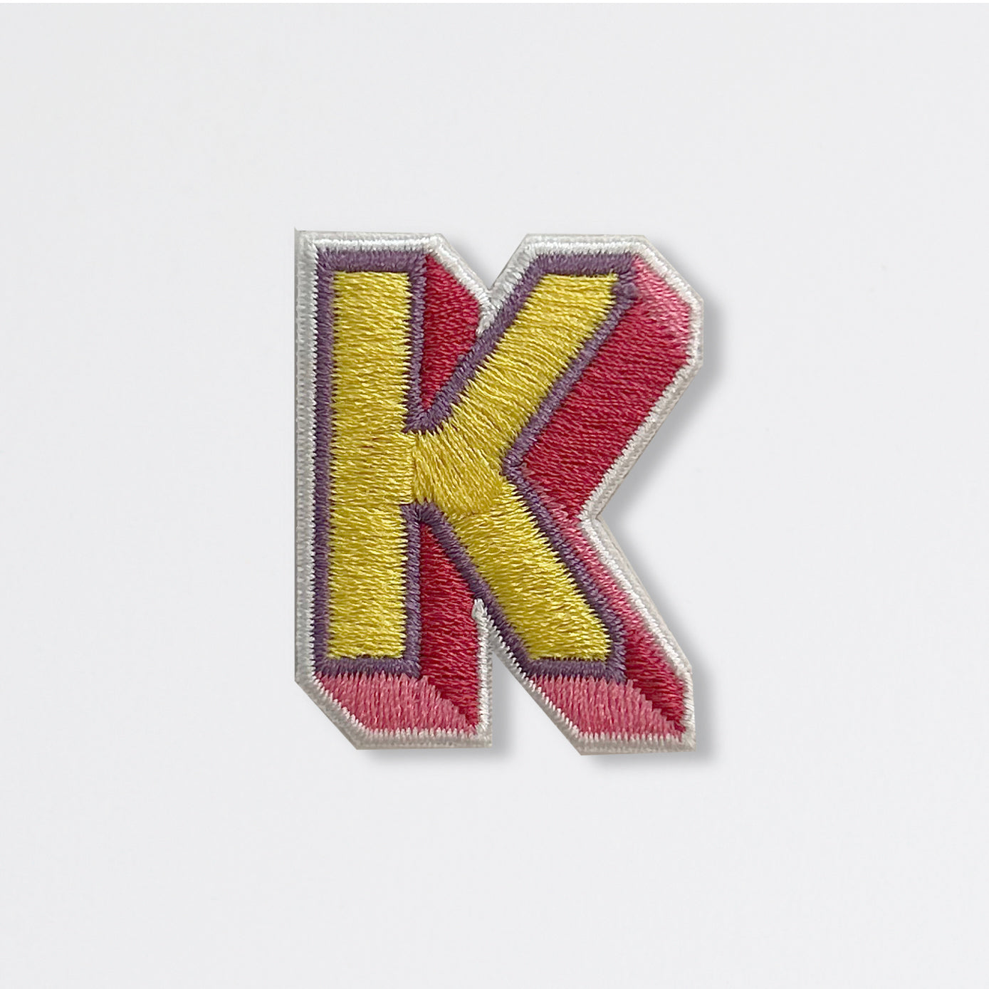 Nooee Pet embroidered patch – letter K in yellow and red