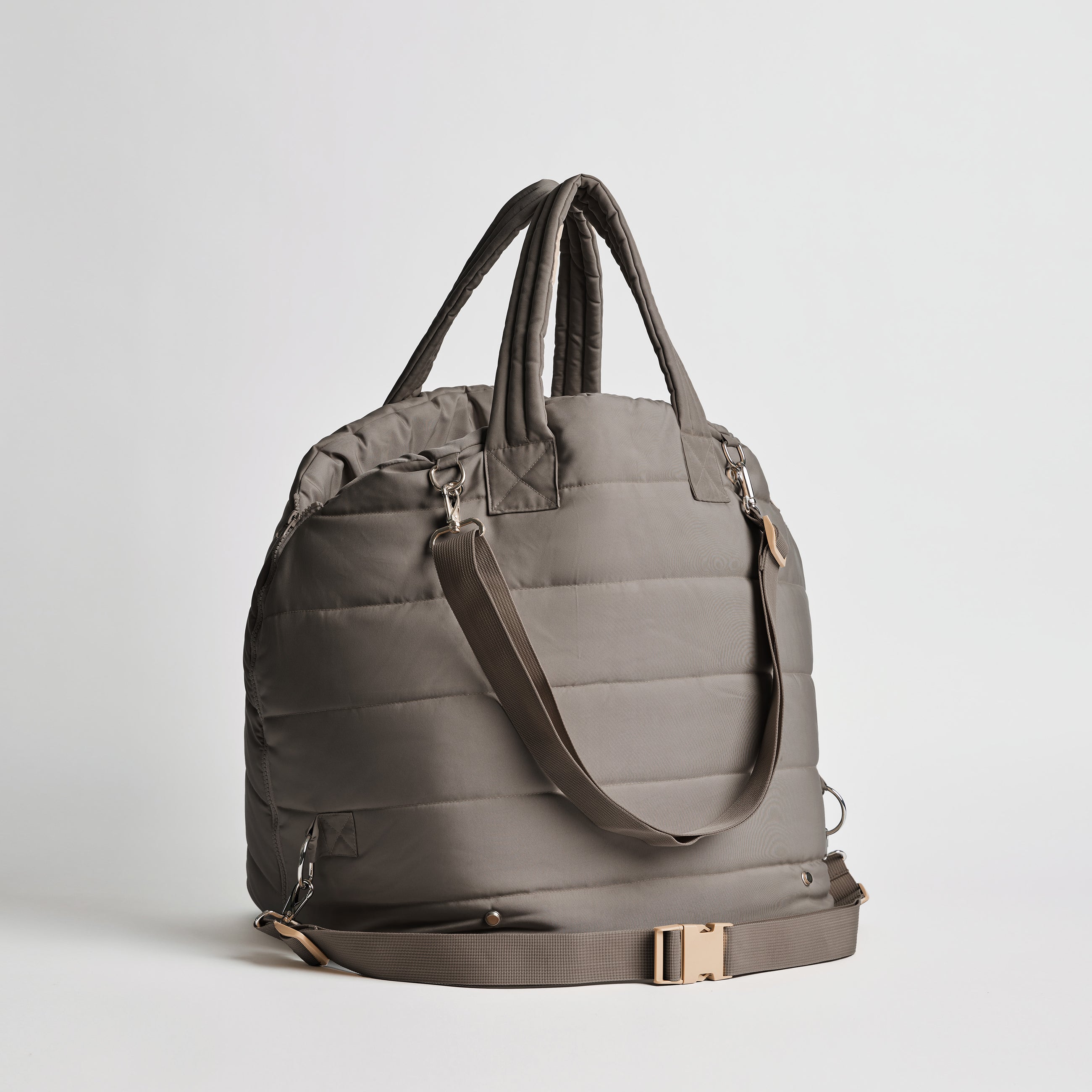 Back view of the Nooee Pet Lola Car Seat in modern gray nylon, showing adjustable bottom strap with buckle, padded top handles, and shoulder strap with silver hardware.