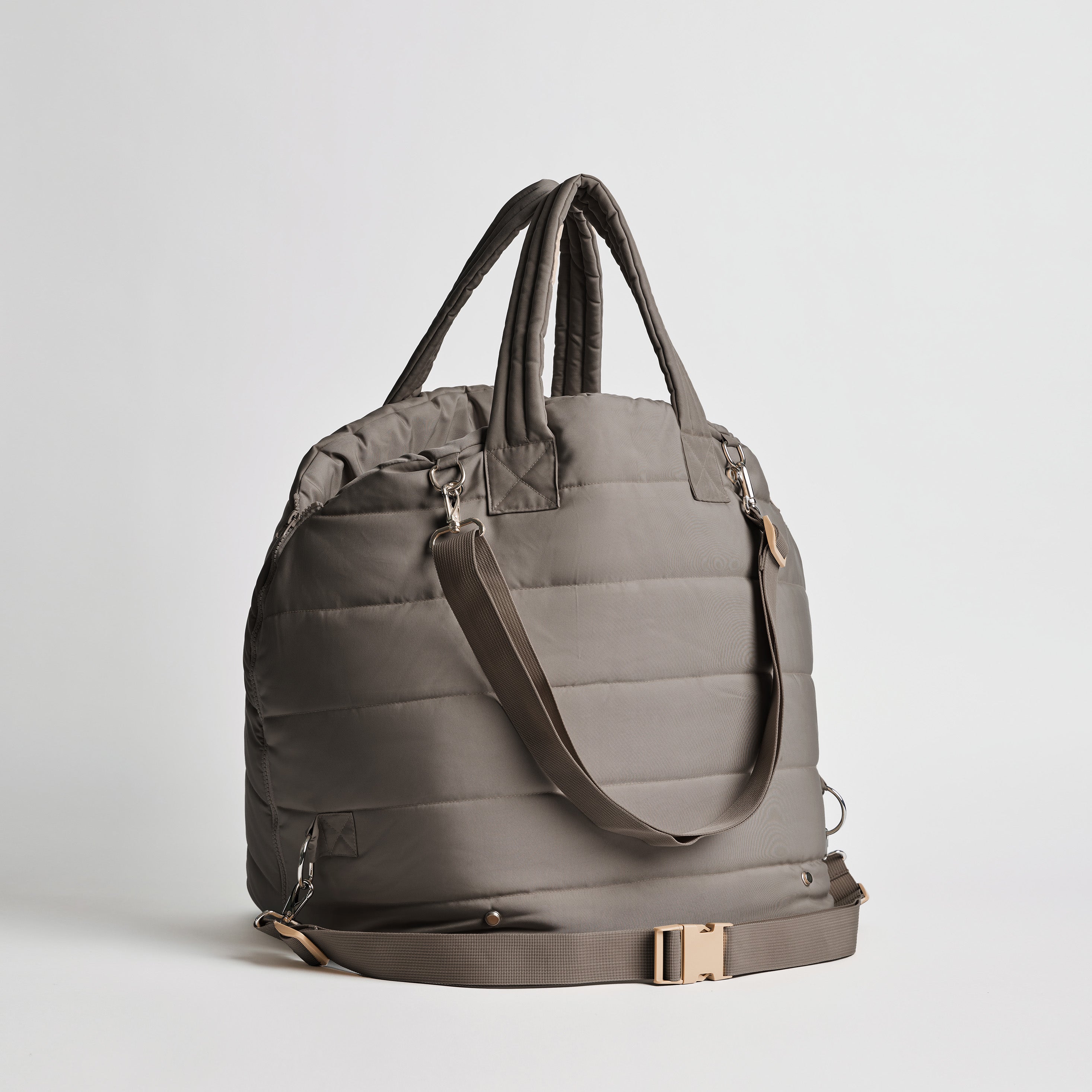 Back view of the Nooee Pet Lola Car Seat in modern gray nylon, showing adjustable bottom strap with buckle, padded top handles, and shoulder strap with silver hardware.
