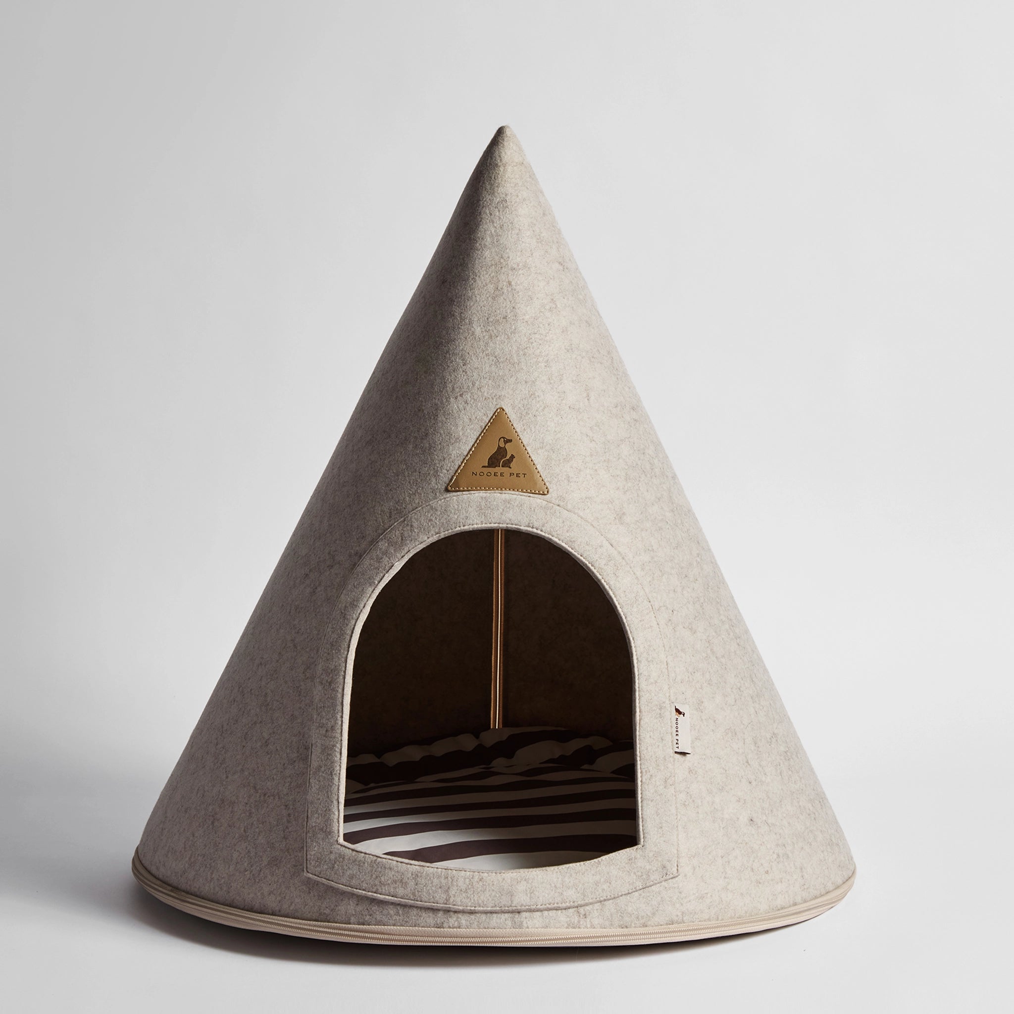 Nooee Pet Molly XL Cream Pet Cave – modern conical dog bed with soft polyester exterior and cotton cushion, arch opening, and tan trim.