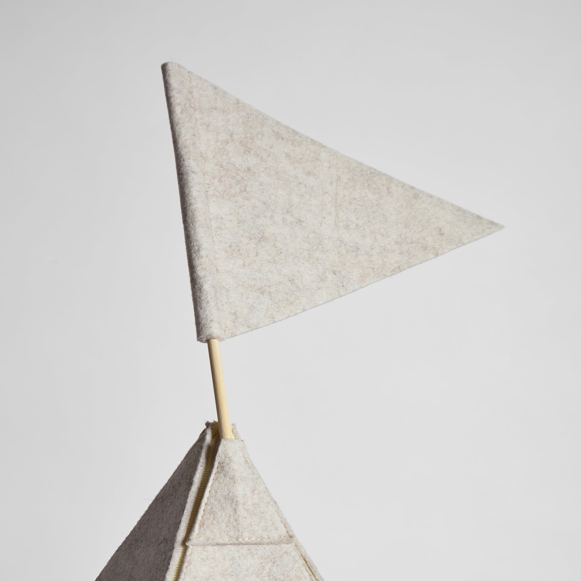 Side profile of Teepee Tucker showing triangular shape and attached flag