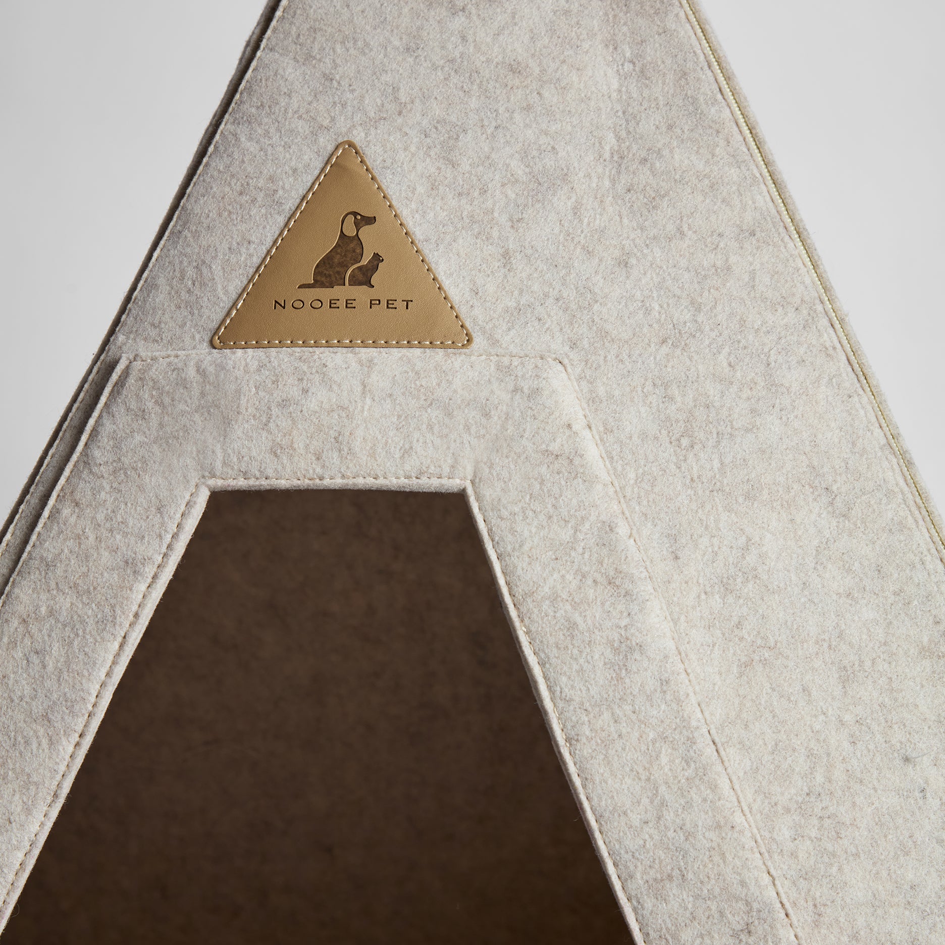 Close-up of Nooee Pet Teepee Tucker entrance with leather logo patch