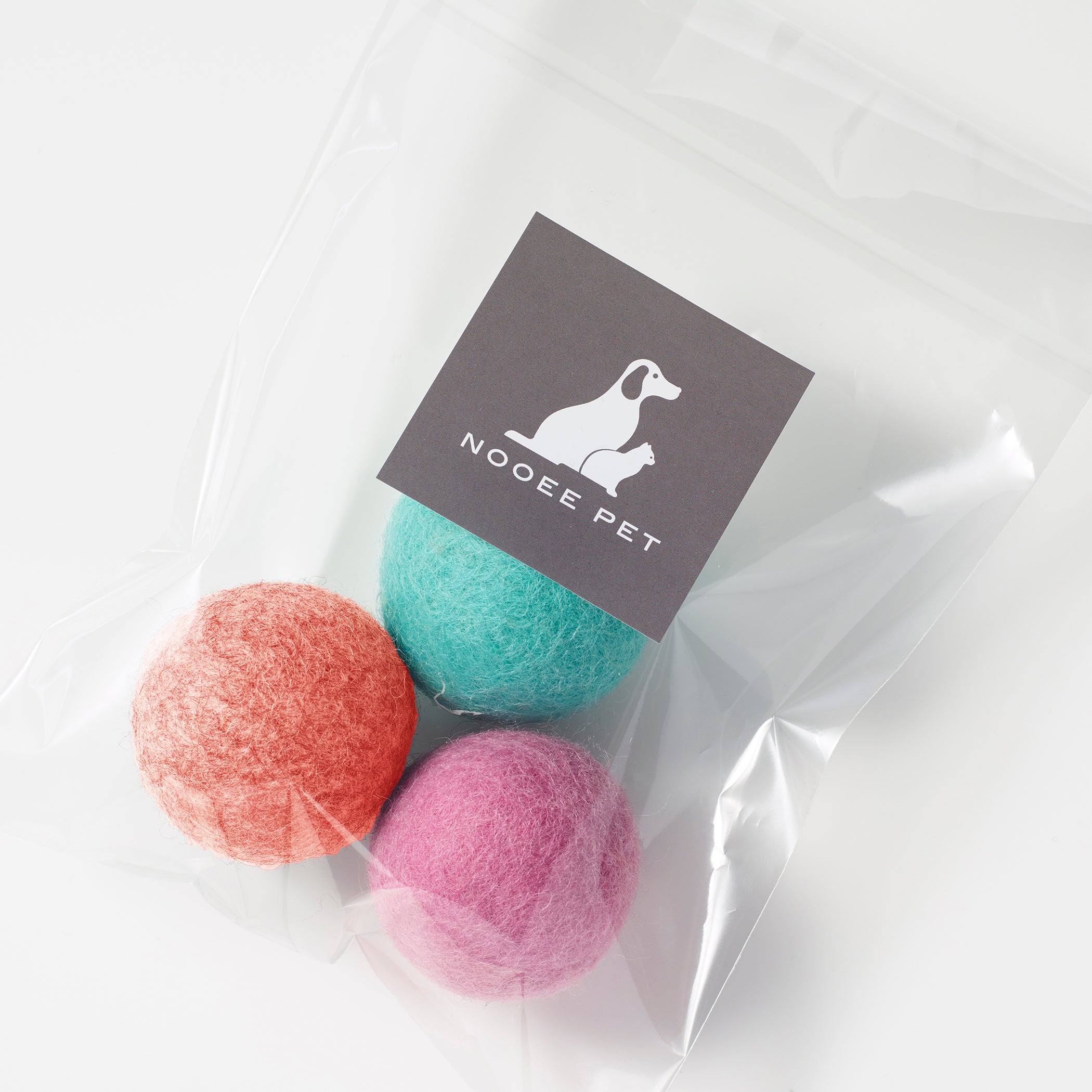 Set of three colorful 4cm wool pet toy balls in clear packaging with Nooee Pet label.