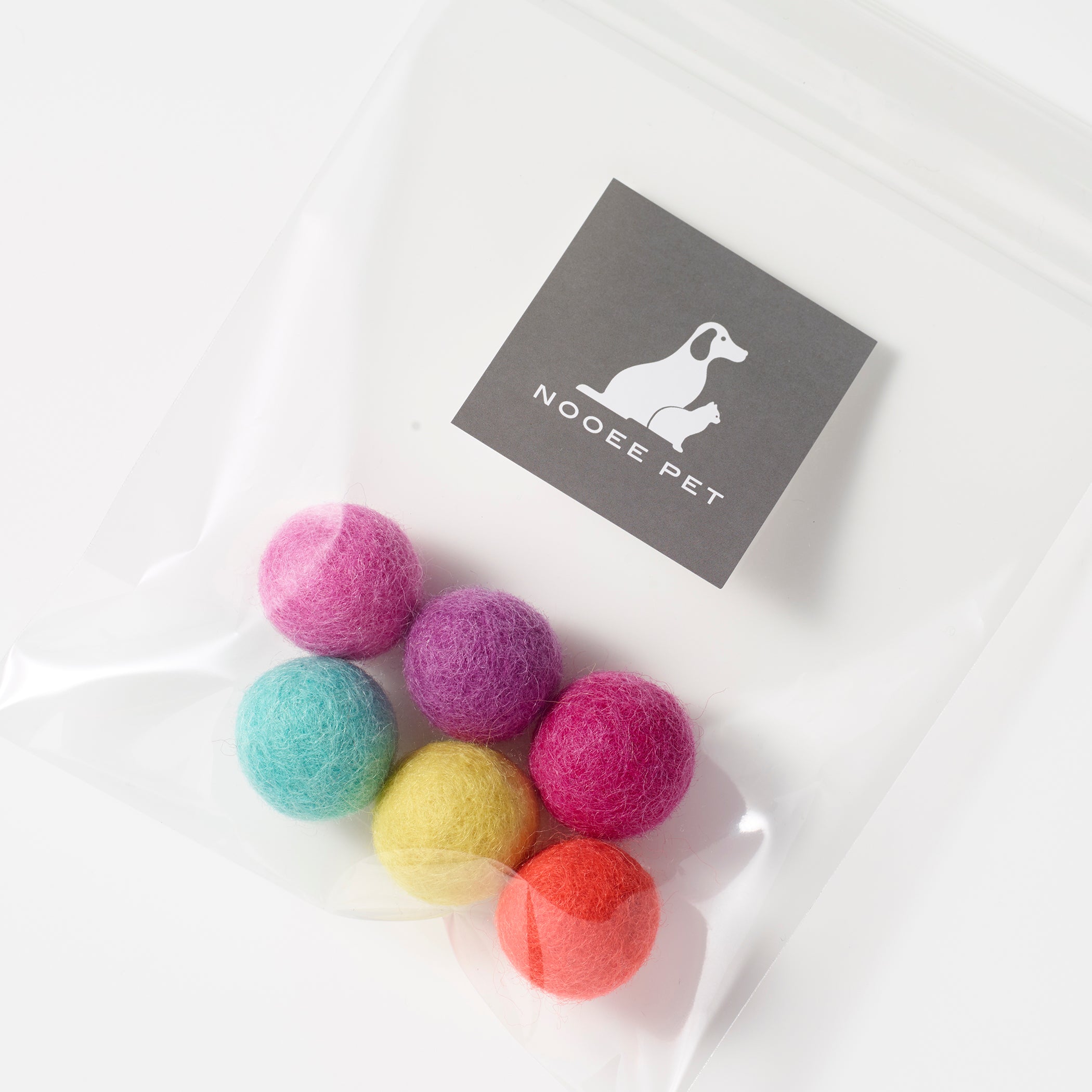 Set of six colorful wool pet toy balls, Bright Set, packaged in a clear bag with Nooee Pet tag.