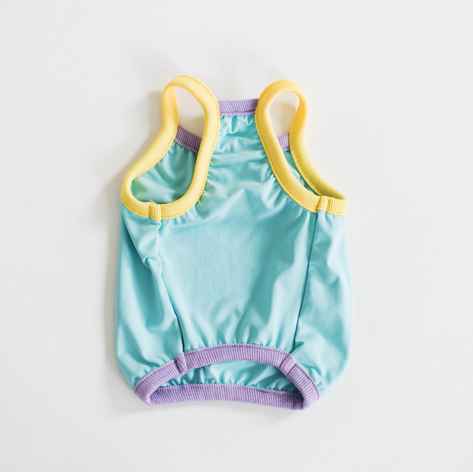 Back view of the Nooee Pet CoolPaws Summer Shirt in blue with yellow and purple trim, showcasing its lightweight and breathable cooling fabric.
