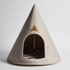 Front view of the Nooee Pet Harry Cave in cream, featuring its arched entrance, soft felt exterior, and striped cushion inside.