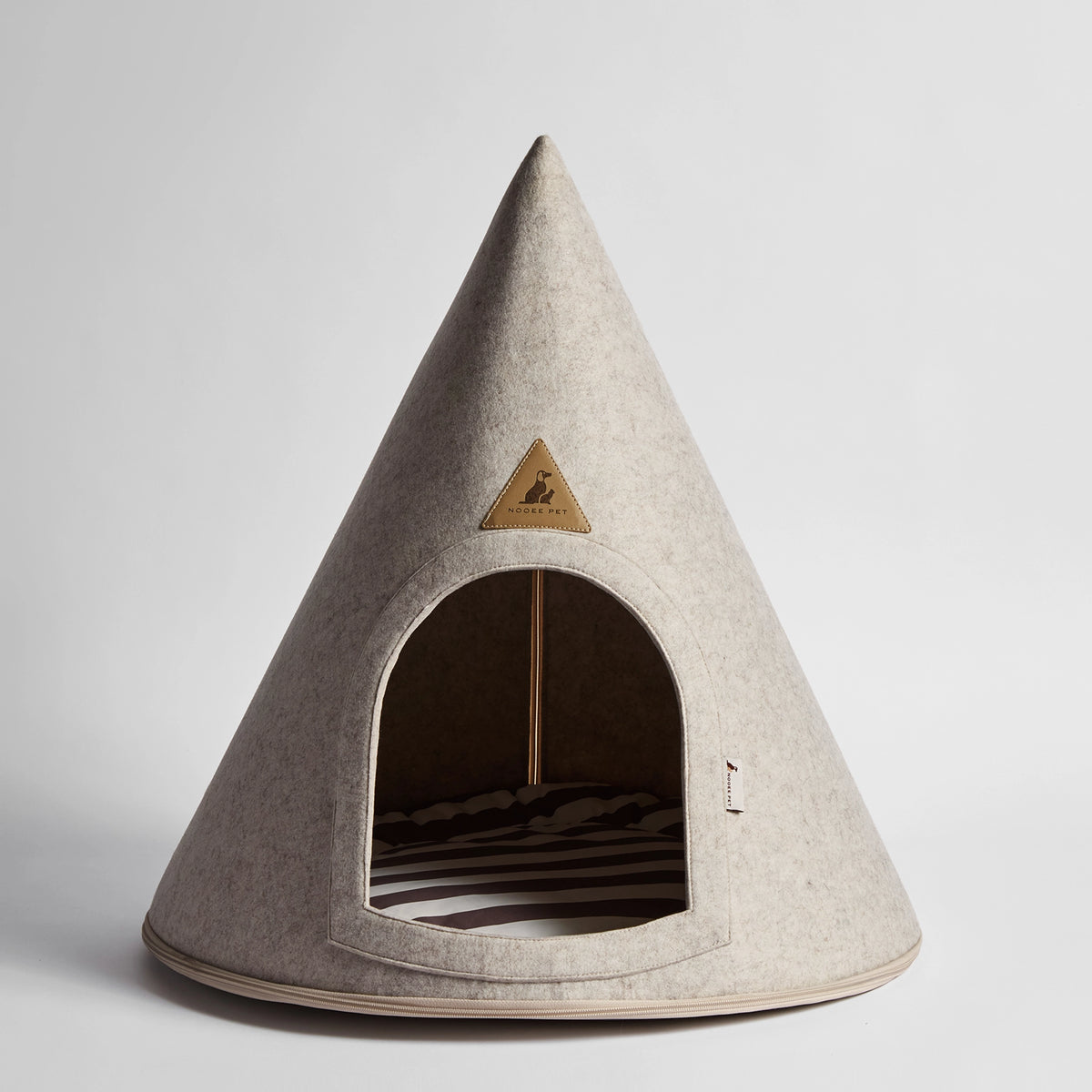 Nooee Pet Molly XL Cream Pet Cave – modern conical dog bed with soft polyester exterior and cotton cushion, arch opening, and tan trim.