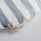 Close-up of the included cushion for the Nooee Pet Harry (XXL) Gray Pet Cave, featuring a stylish blue and white striped fabric with a Nooee Pet logo tag.