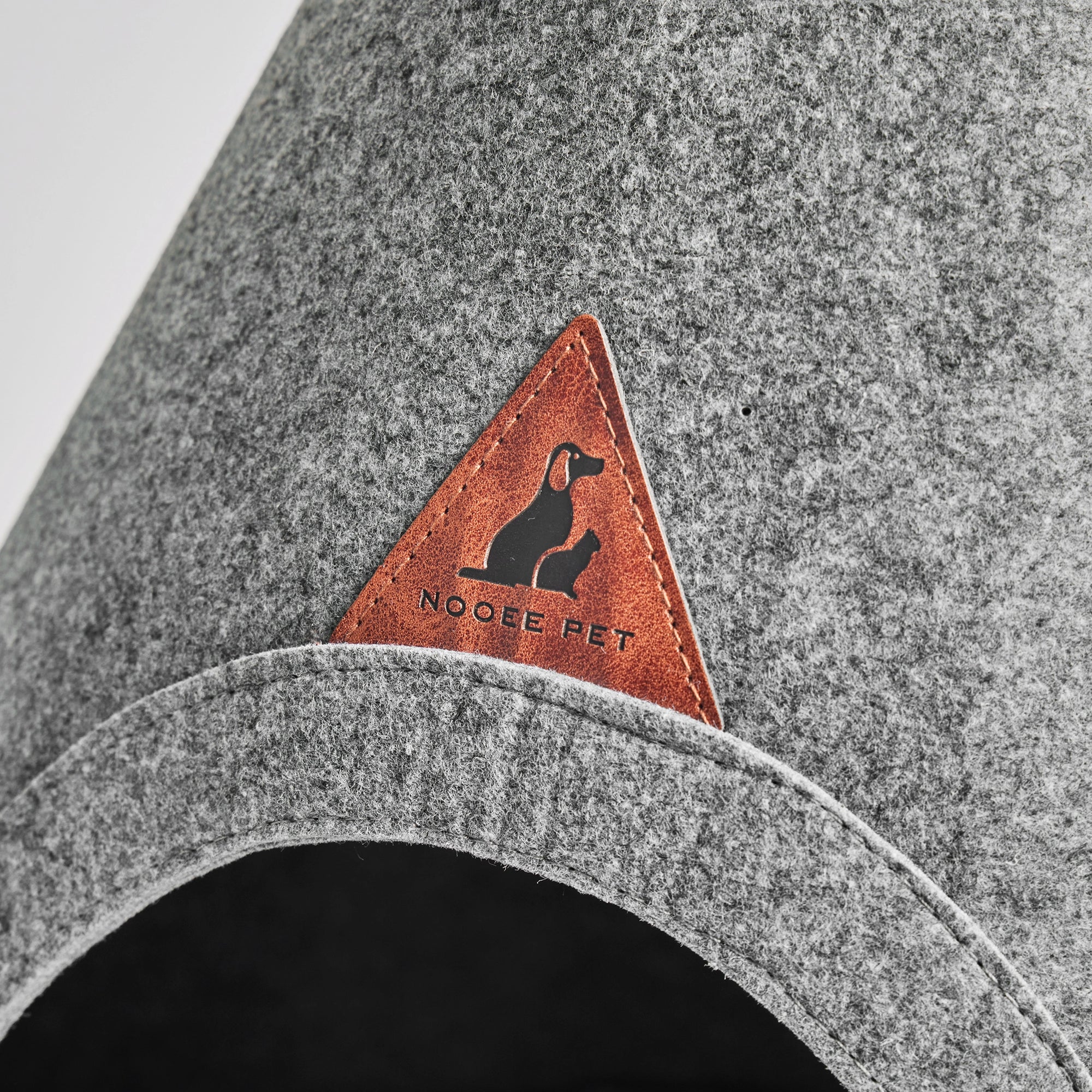Nooee Pet Cave Buddy (L) in Gray, a stylish and modern dog bed with a conical shape and oval entrance.