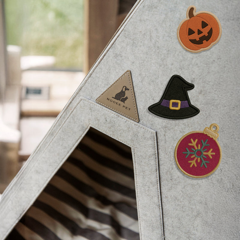 Nooee Pet felt dog cave bed decorated with embroidered holiday patches