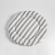 Flat-lay of Nooee Pet Replacement Cushion in gray and white stripes, featuring a soft, round design ideal for refreshing your pet’s cave or using as a cozy mat anywhere.