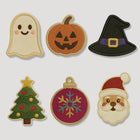 Six embroidered holiday patches featuring Halloween and Christmas designs