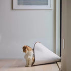 Small dog entering a Nooee Pet felt Nabi cave