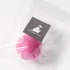 Pink wool toy ball in clear packaging