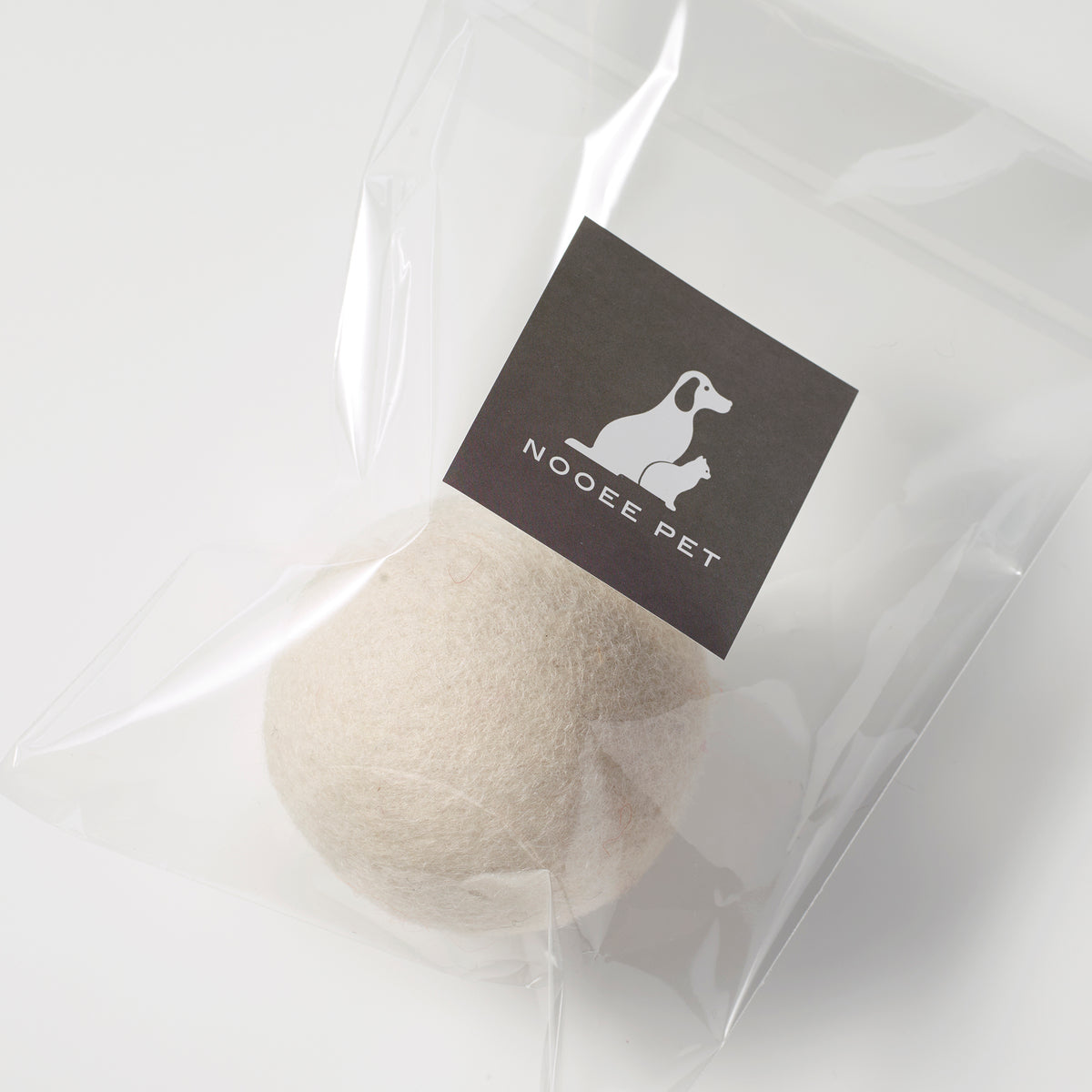 White wool toy ball in clear packaging