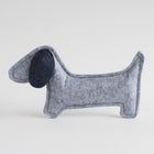 Light gray felt dog-shaped toy with a dark gray floppy ear, shown against a clean white background.