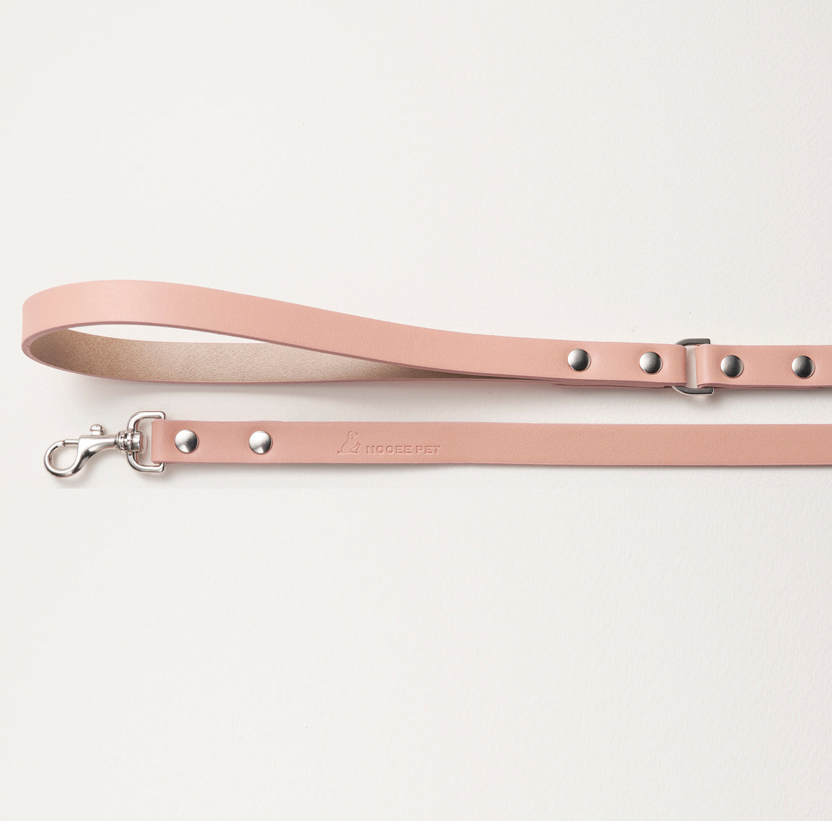 Close-up of pink Daisy Leash hardware with nickel-plated clasp